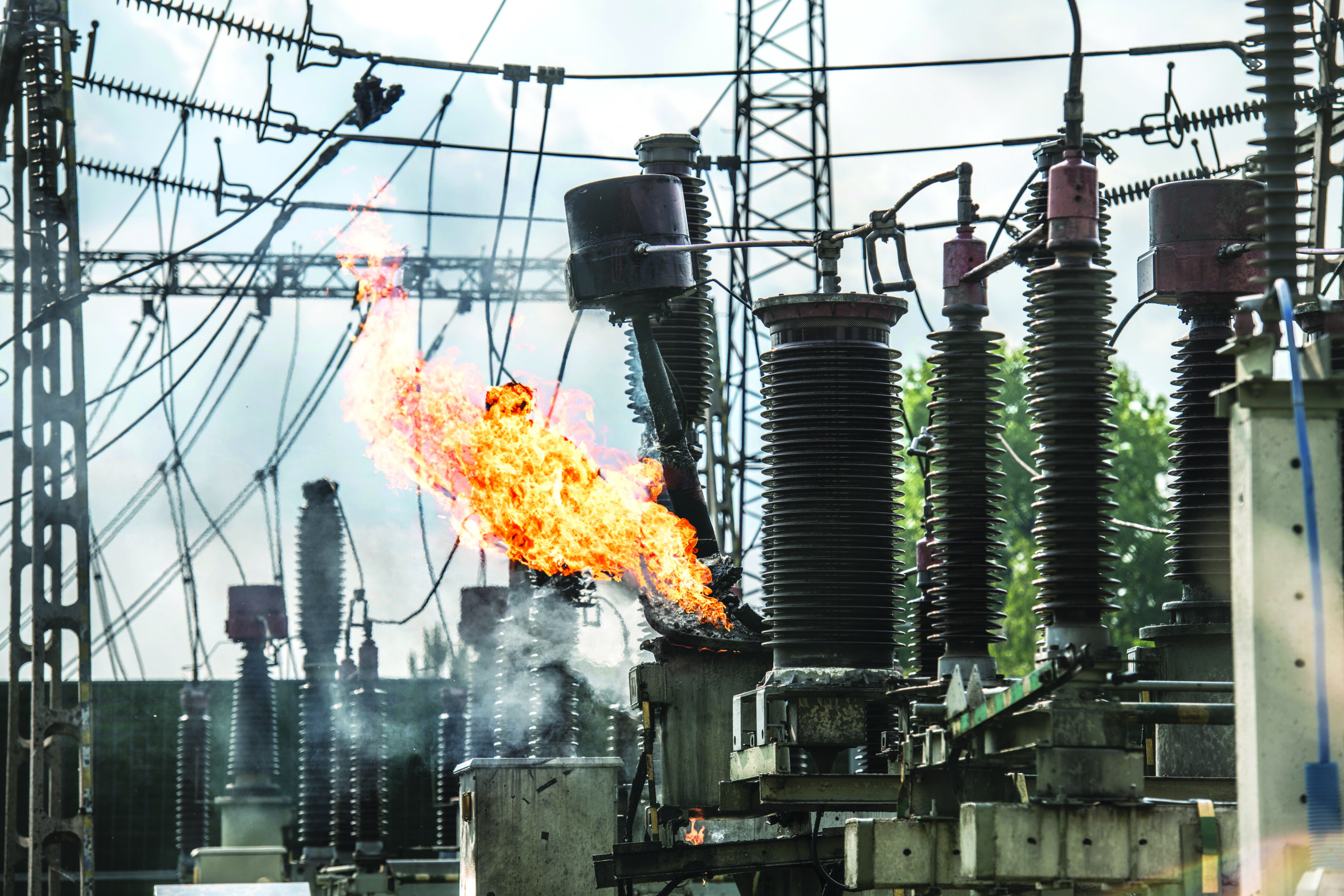 Transformer explosion in power plant. High-voltage insulator on fire. Electric explosion.